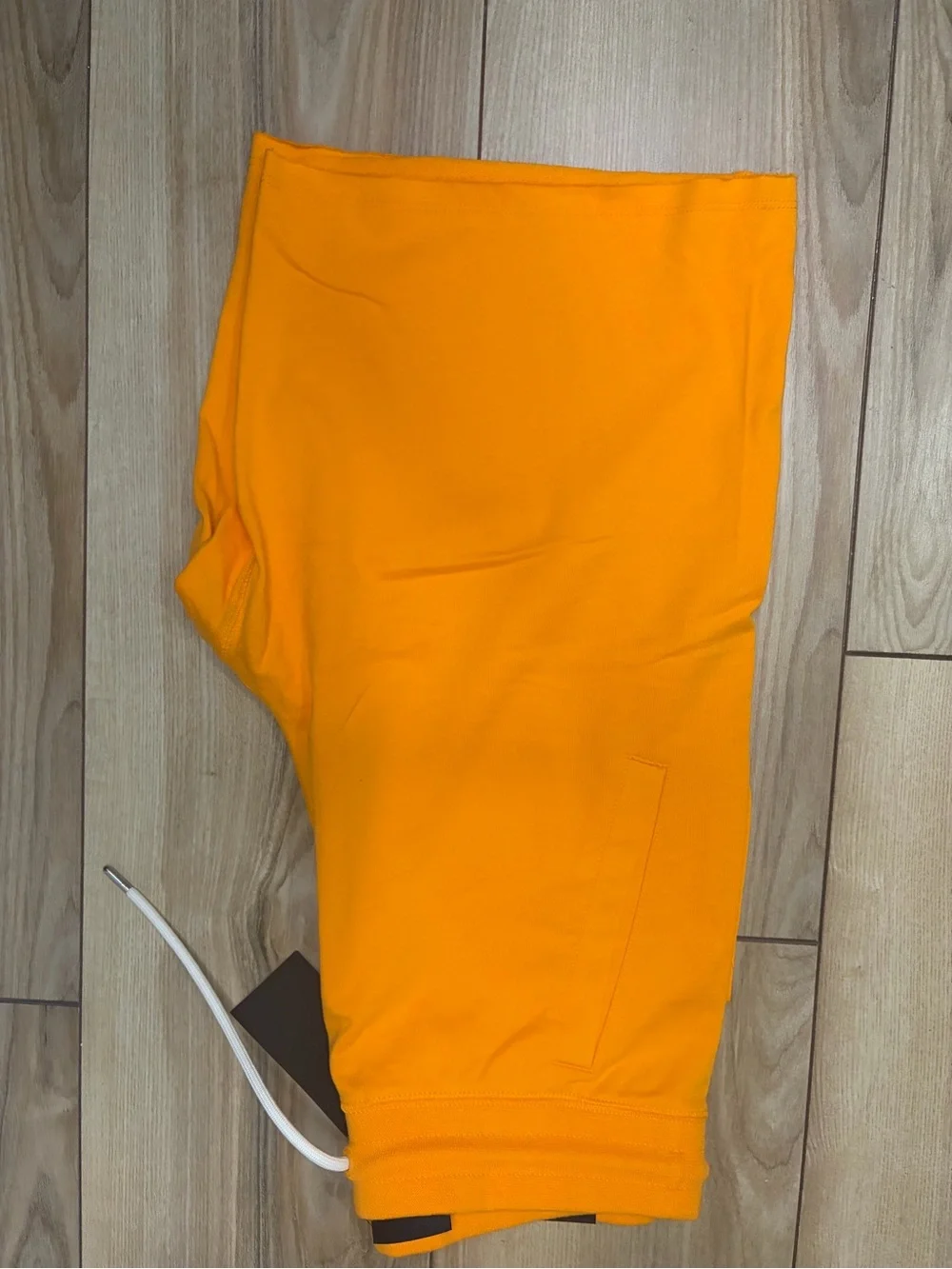 Nike Bright Orange Athletic Shorts with White Swoosh Tag